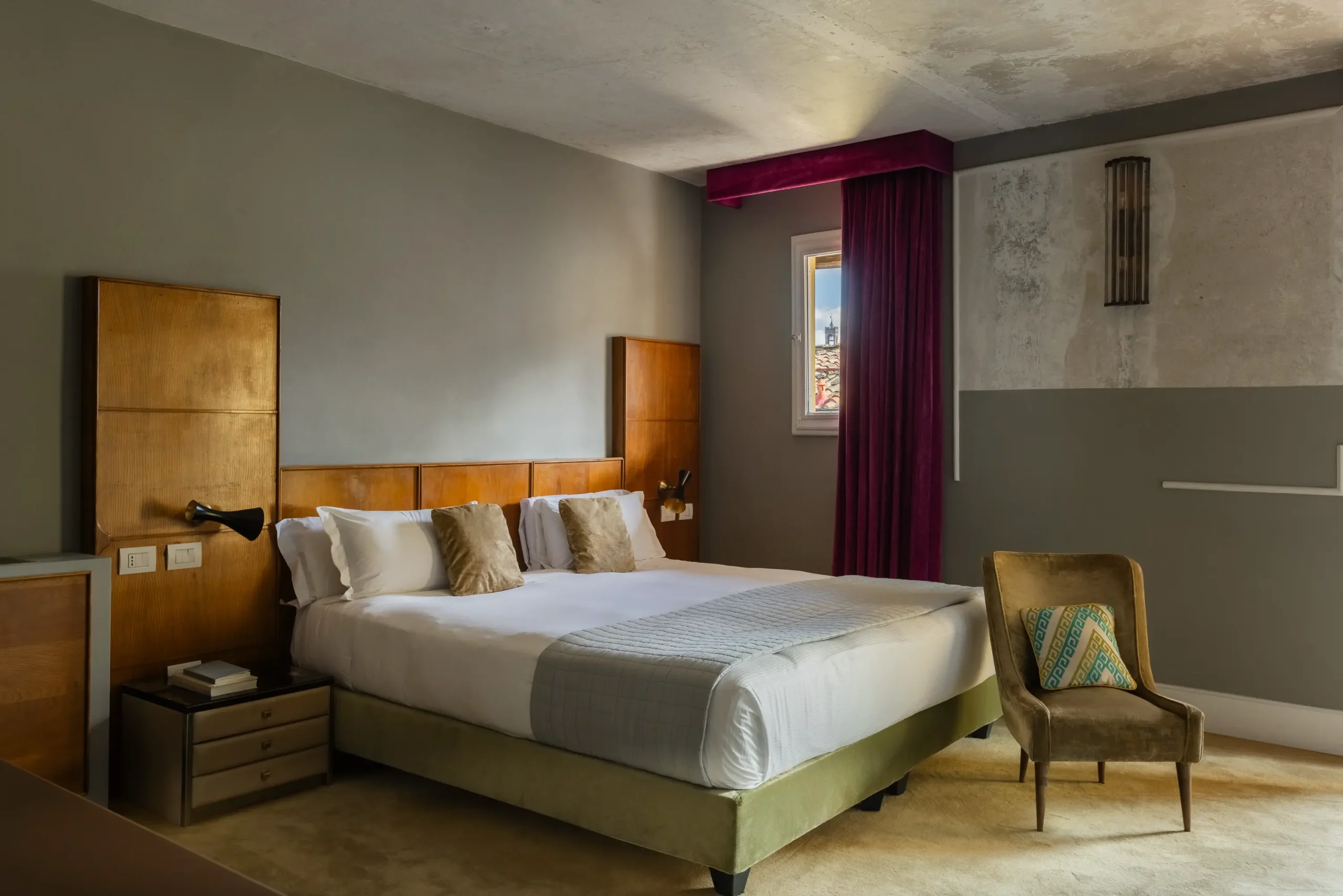 Boutique hotel interior at Oltrarno Splendid Florence featuring eclectic vintage design, layered textures, natural light, and elegant Italian atmosphere.