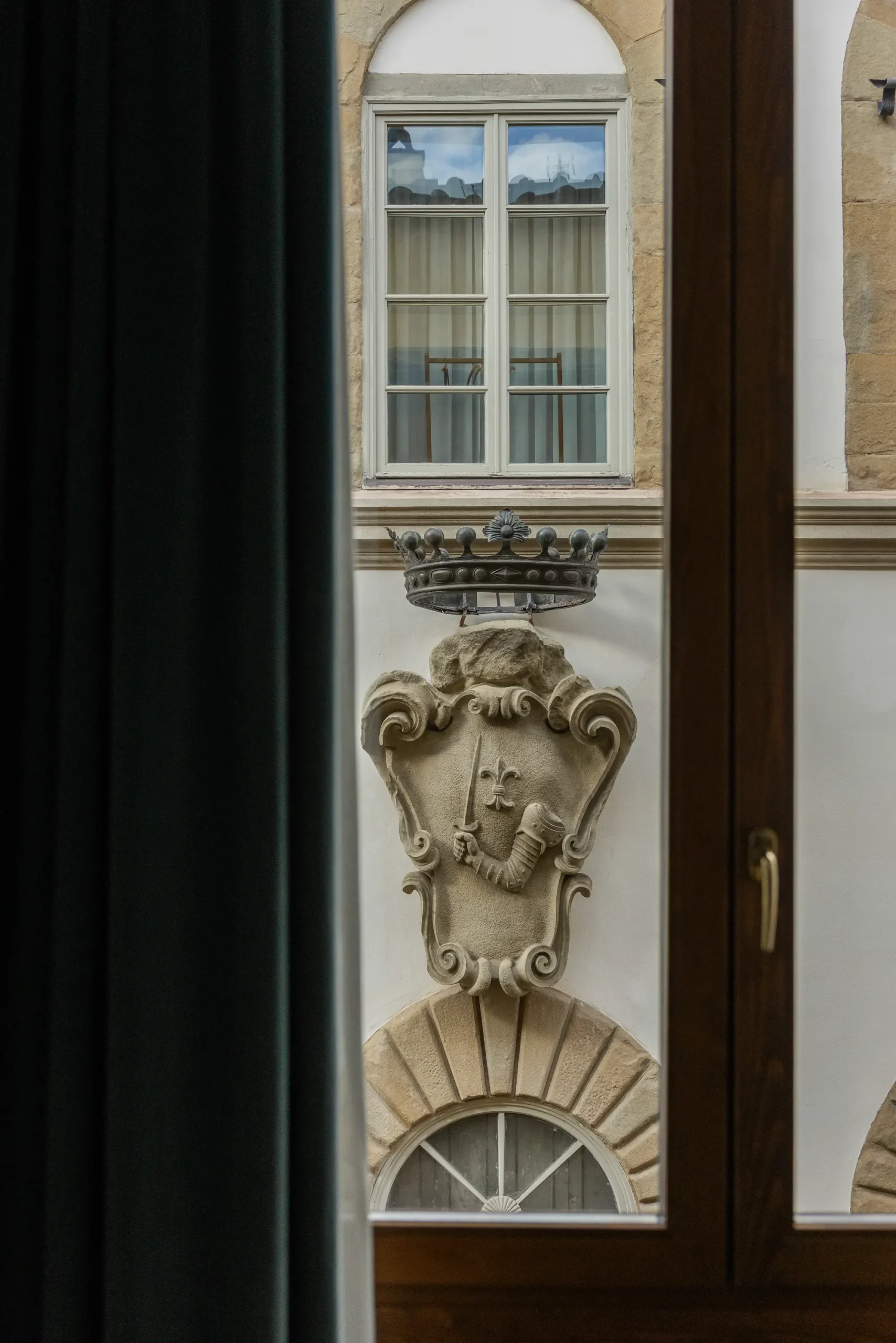 Boutique hotel interior at Oltrarno Splendid Florence featuring eclectic vintage design, layered textures, natural light, and elegant Italian atmosphere.