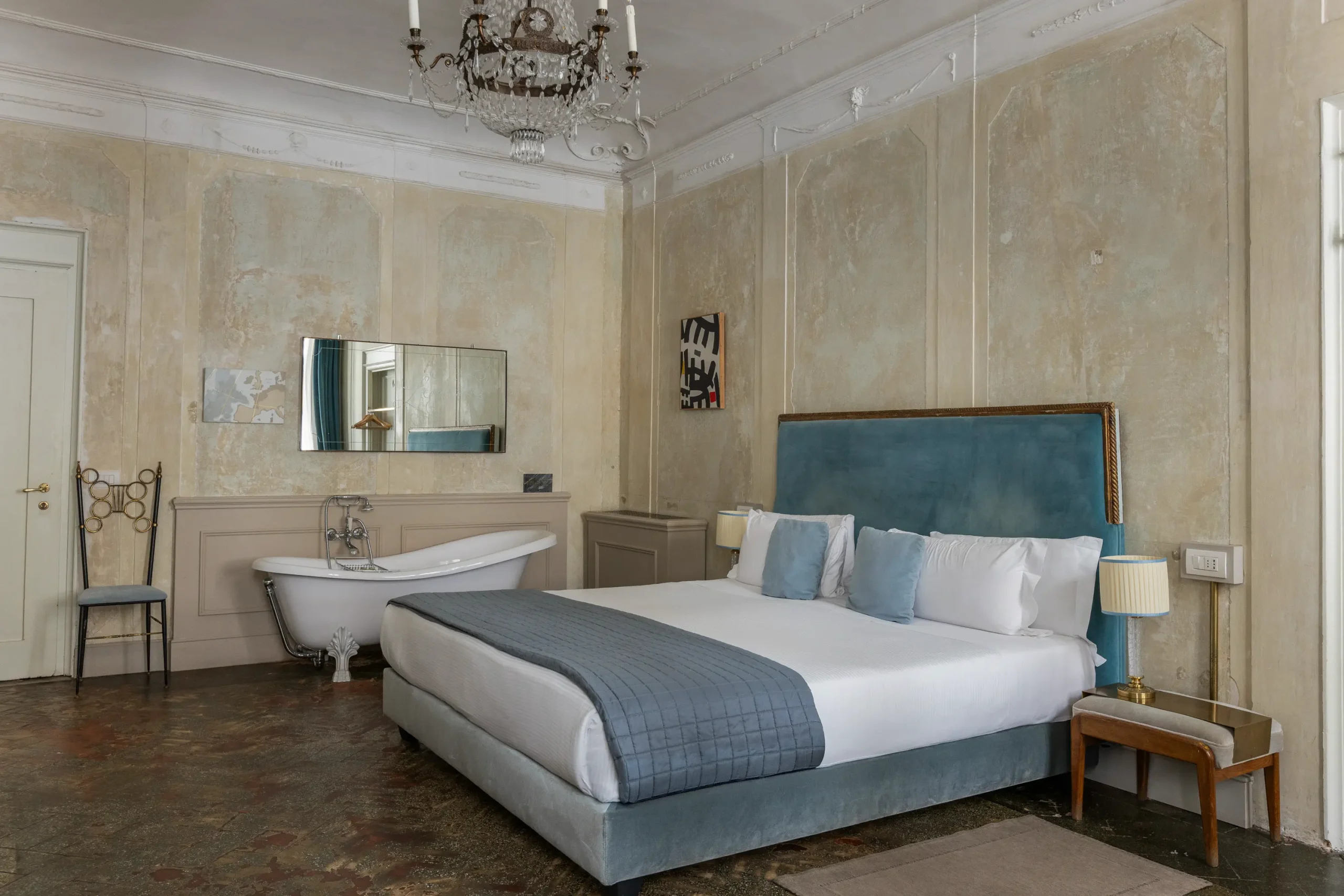 Boutique hotel interior at Oltrarno Splendid Florence featuring eclectic vintage design, layered textures, natural light, and elegant Italian atmosphere.