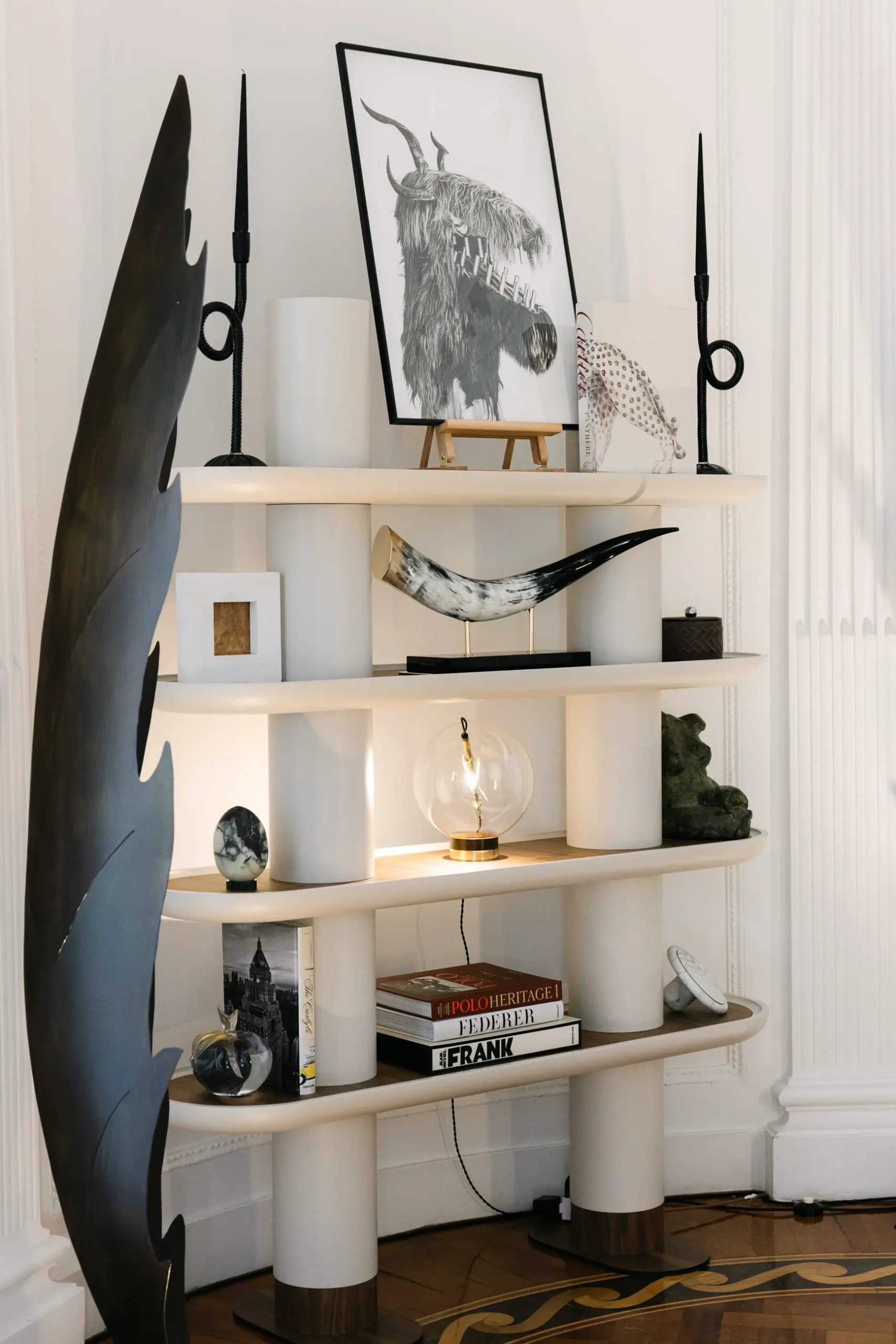 Contemporary interior installation by Artemest in Milan featuring collectible Italian design, sculptural furniture, layered textures, warm tones, and atmospheric natural light.
