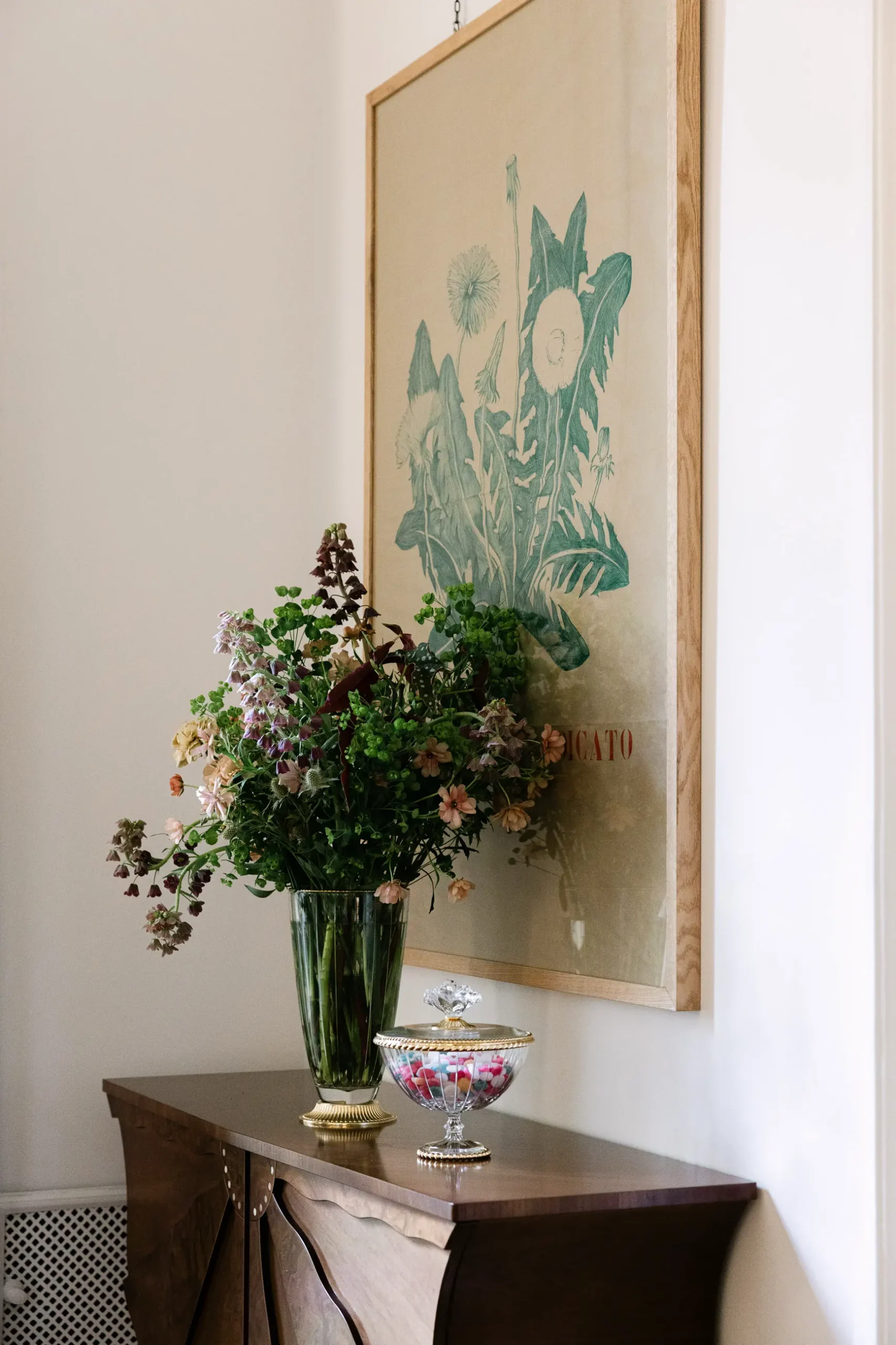 Contemporary interior installation by Artemest in Milan featuring collectible Italian design, sculptural furniture, layered textures, warm tones, and atmospheric natural light.