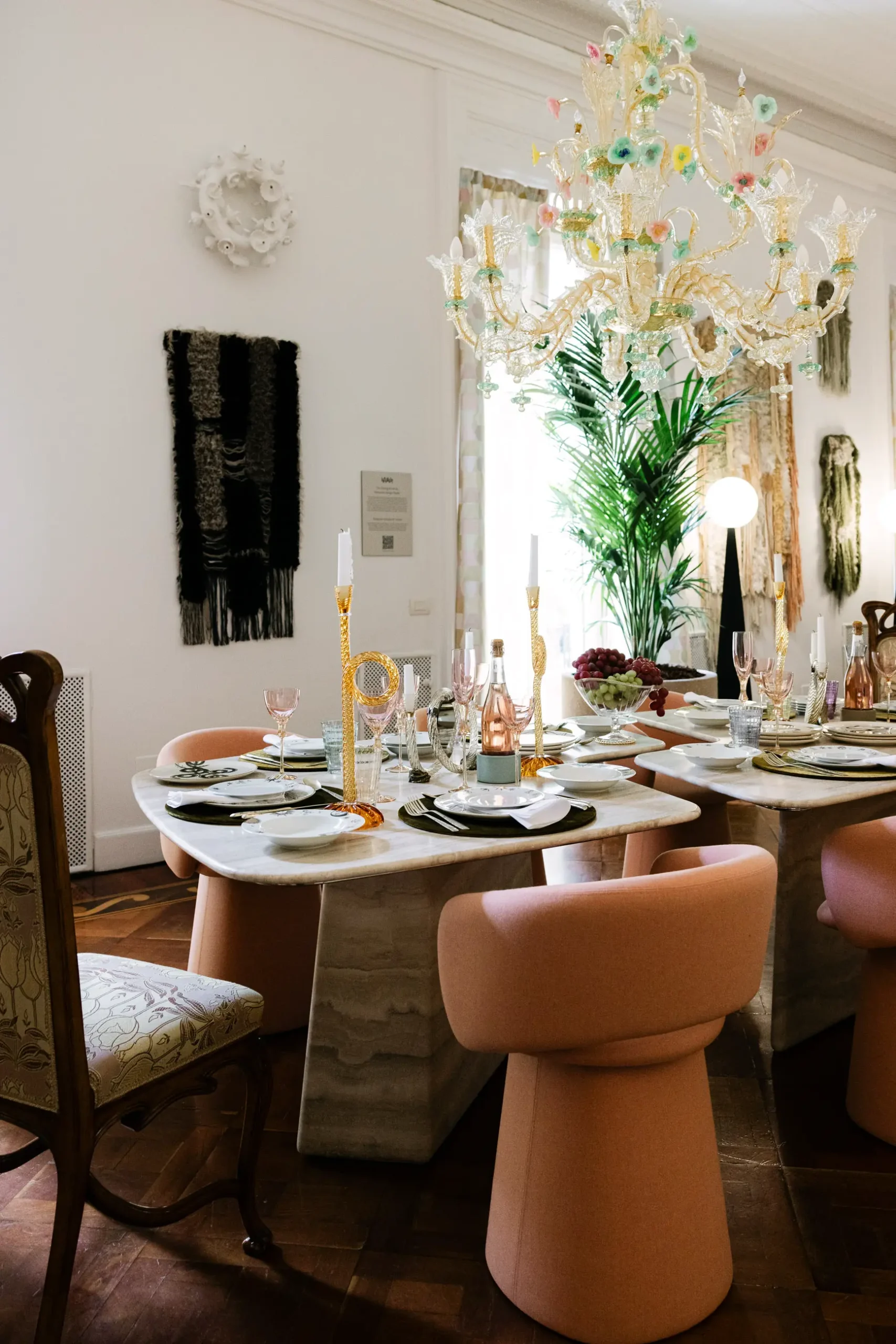 Contemporary interior installation by Artemest in Milan featuring collectible Italian design, sculptural furniture, layered textures, warm tones, and atmospheric natural light.