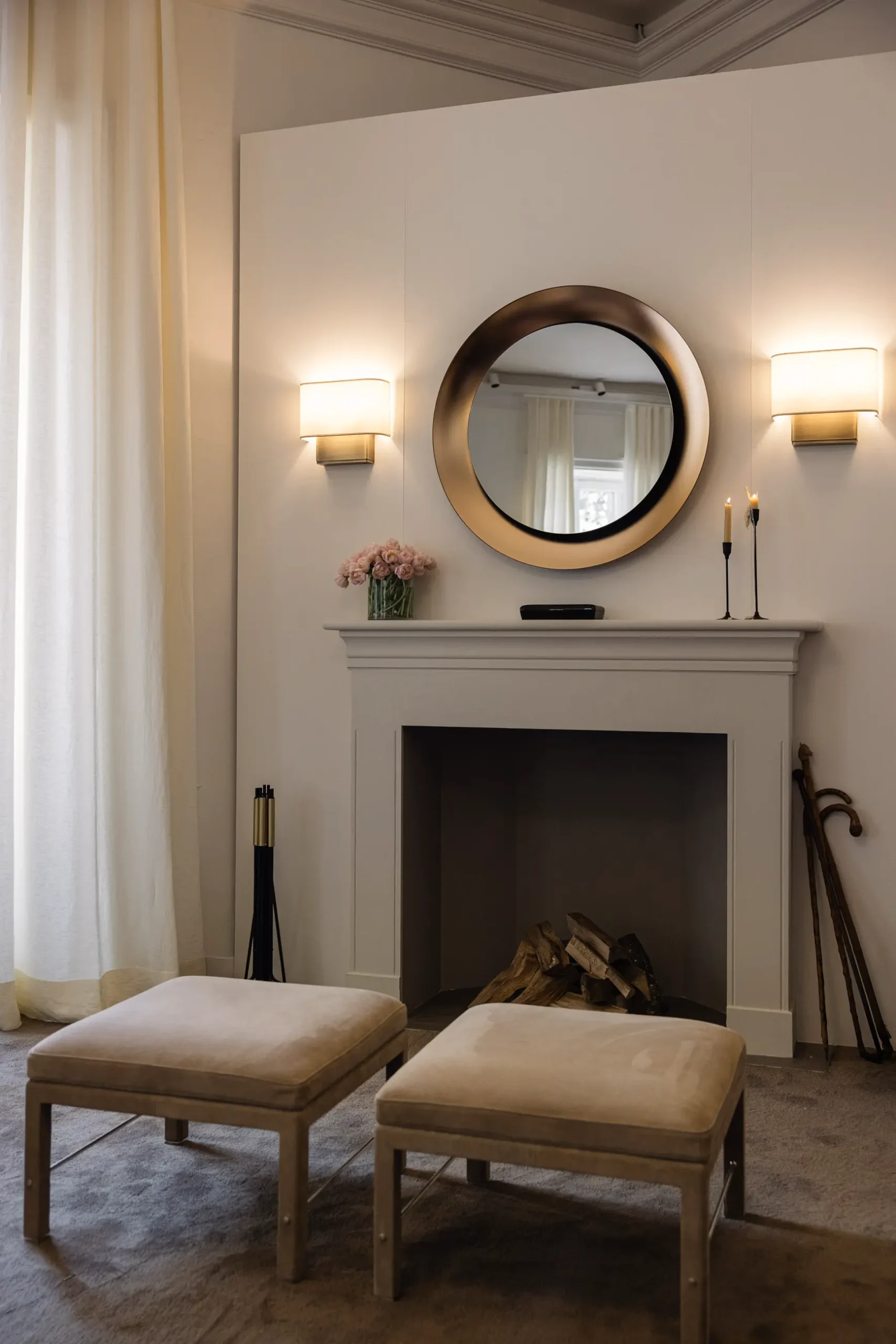 Contemporary interior installation by Artemest in Milan featuring collectible Italian design, sculptural furniture, layered textures, warm tones, and atmospheric natural light.