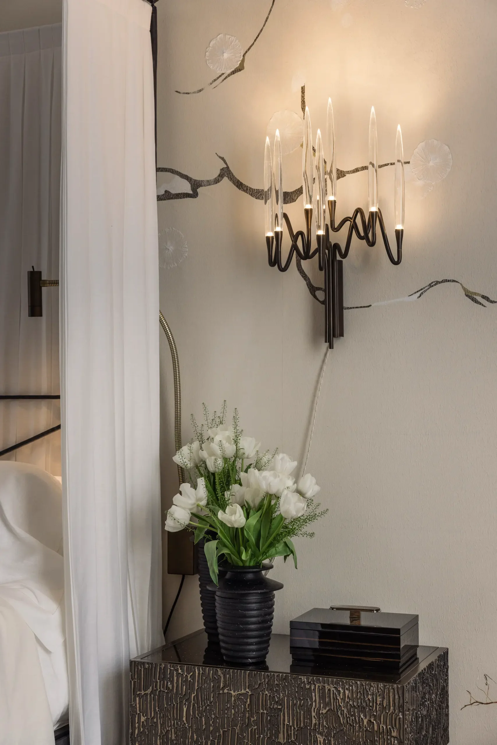 Contemporary interior installation by Artemest in Milan featuring collectible Italian design, sculptural furniture, layered textures, warm tones, and atmospheric natural light.