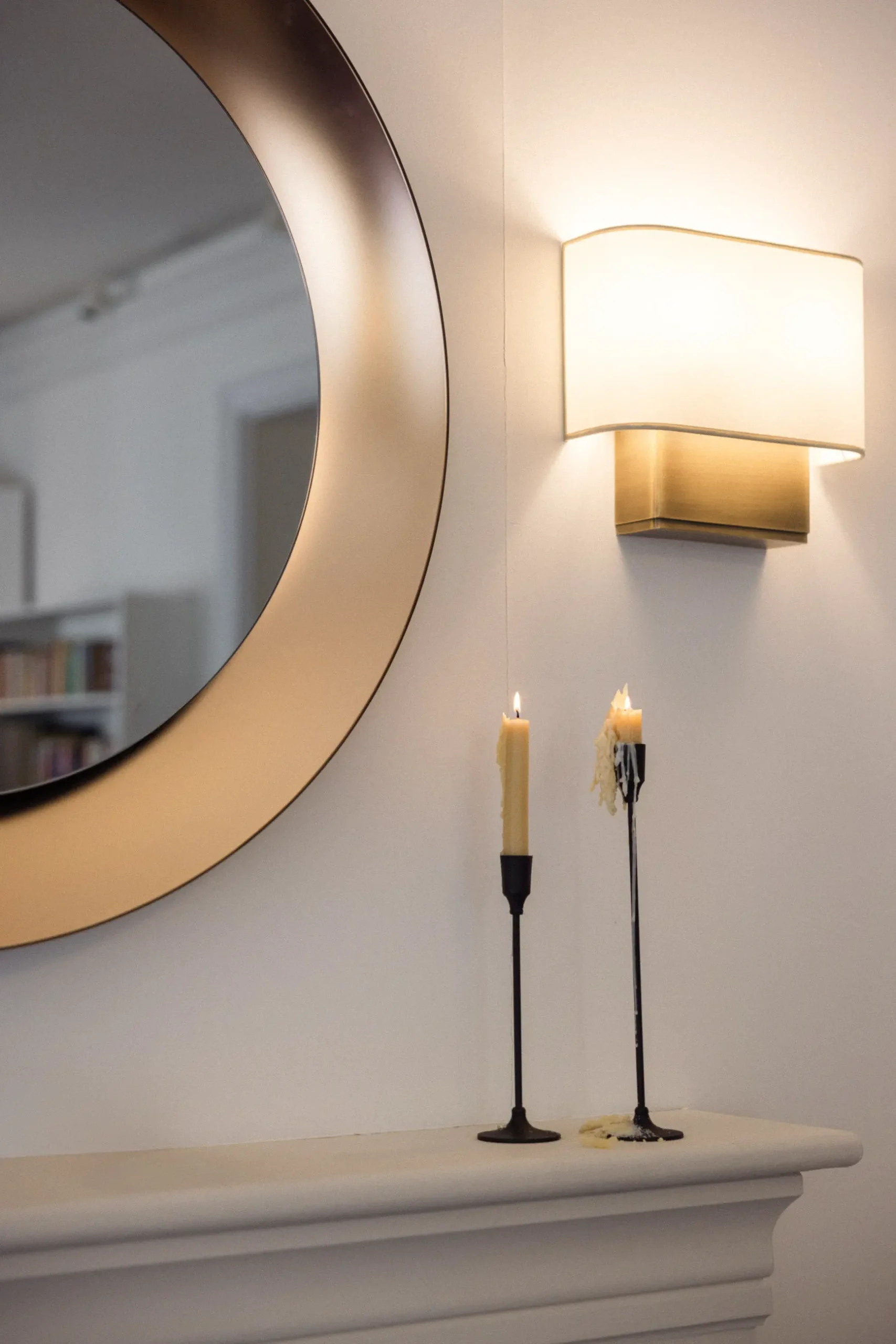 Contemporary interior installation by Artemest in Milan featuring collectible Italian design, sculptural furniture, layered textures, warm tones, and atmospheric natural light.