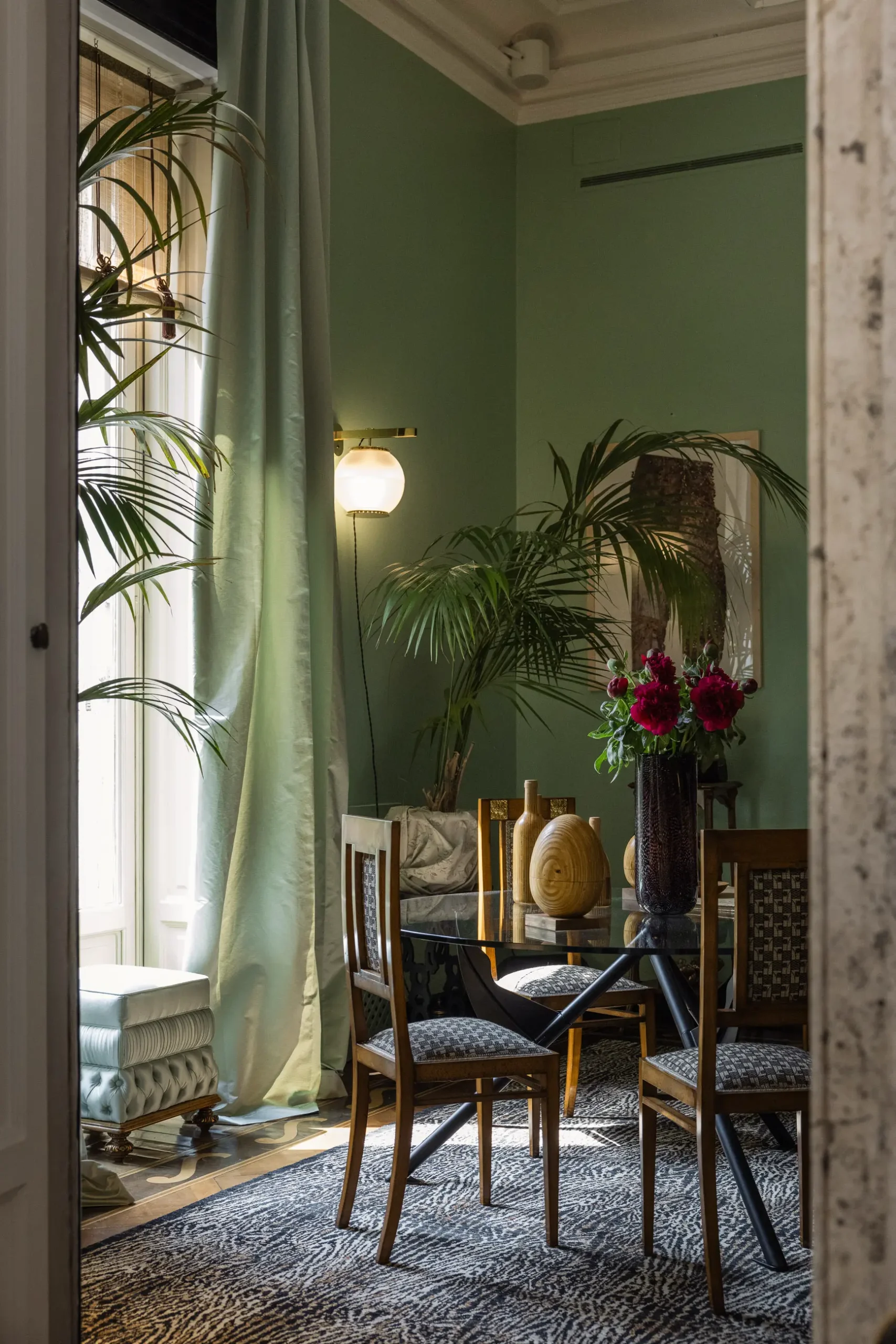 Contemporary interior installation by Artemest in Milan featuring collectible Italian design, sculptural furniture, layered textures, warm tones, and atmospheric natural light.